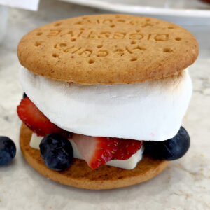 Yummy Fruit Smores with Berry and white chocolate on a digestive cookie.