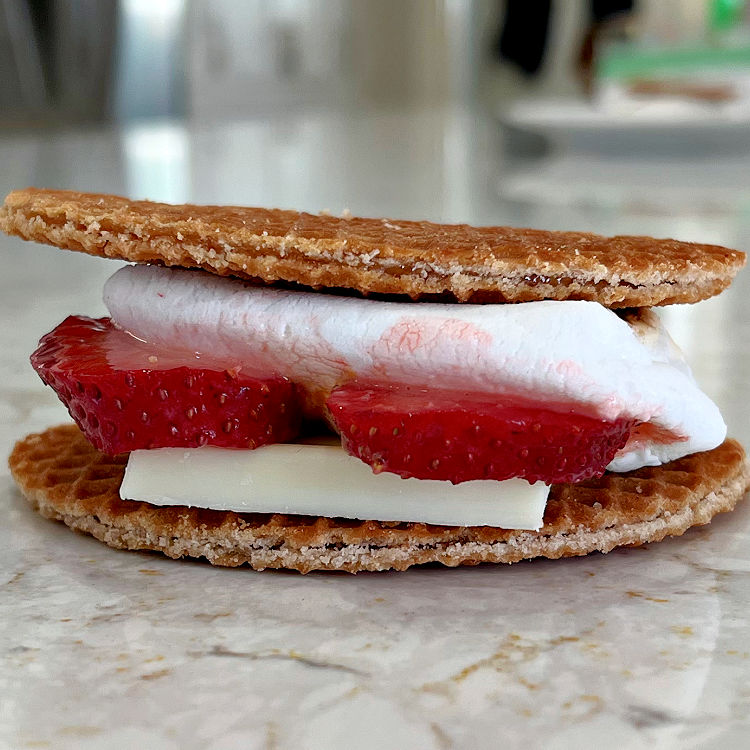 Stroopwafel Caramel Smores with white chocolate, strawberries, and marshmallow.