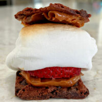 Caramel Smores made with brownie brittle, strawberry, and roasted marshmallow.