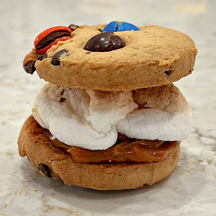 M&M cookie Smores with Dulce De Leche and toasted marshmallow.