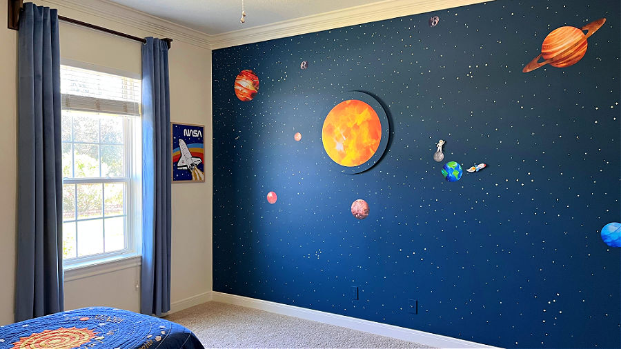 Outer Space Wall Mural in a kids space themed room.