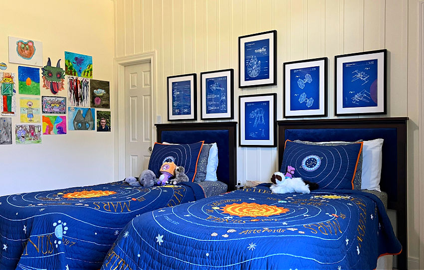 Image of a kids space themed bedroom with solar system bedding, cool star wars wall art and lattice board and batten feature wall.