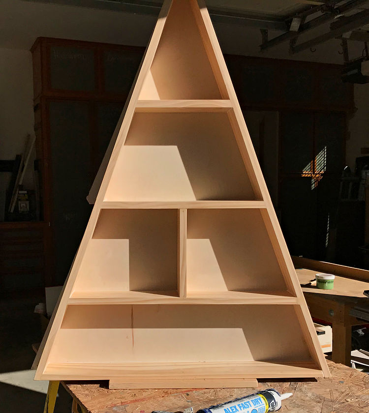 Image of a DIY Wooden Christmas Tree Village Display Shelf with free build plans.