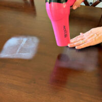 Using a blow dryer to repair heat marks on wood tables is the easiest way to remove a heat stain or water ring.