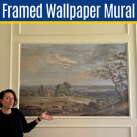Image of a DIY Framed Wallpaper Mural for a post about how to frame wallpaper with trim on a wall.