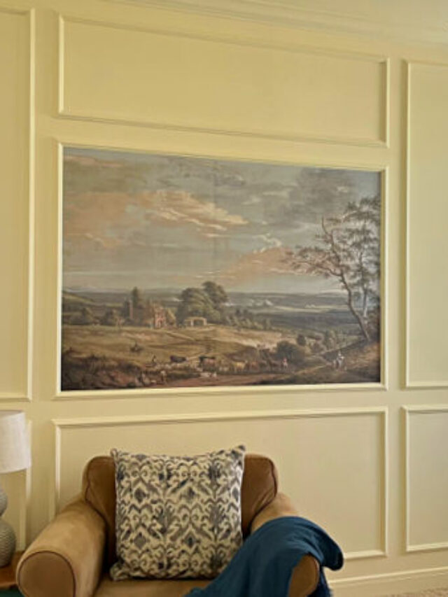 Image of a Framed Wallpaper Mural DIY for a post about how to frame a wallpaper mural with picture frame trim on a wall.