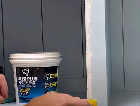 Using caulk and spackling on trim that covers plywood edges.