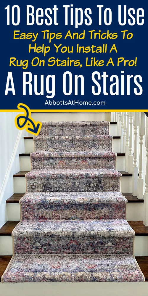 Image of a 3x5 area rug on wooden stairs. For a post with tips for how to put a rug on stairs, like a pro.