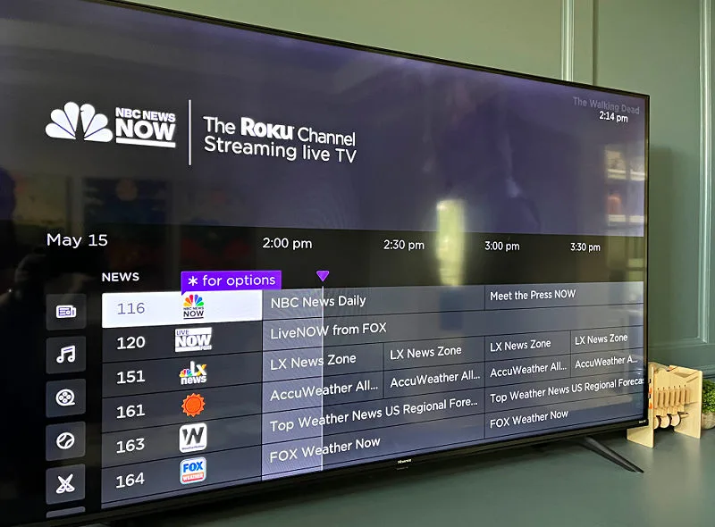 Image of a TV showing the guide to Roku TV for a post about how to cut cable and still watch TV for free.