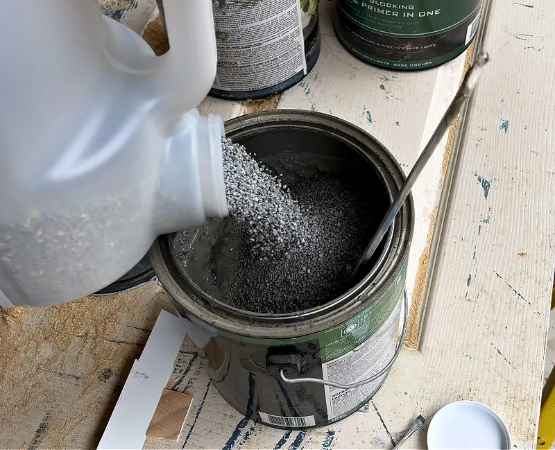 Image of putting kitty litter in paint to harden paint for disposal.