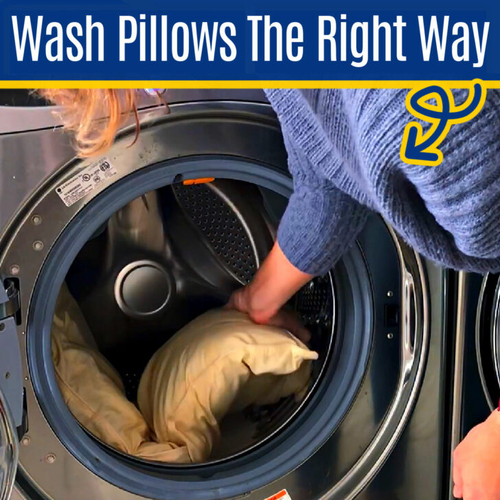 Image of someone washing pillows in a washing machine for a post about how to wash pillows in a washing machine.