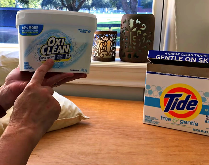 Image of Tide Detergent and OxiClean White Revive used to whiten yellow pillows.
