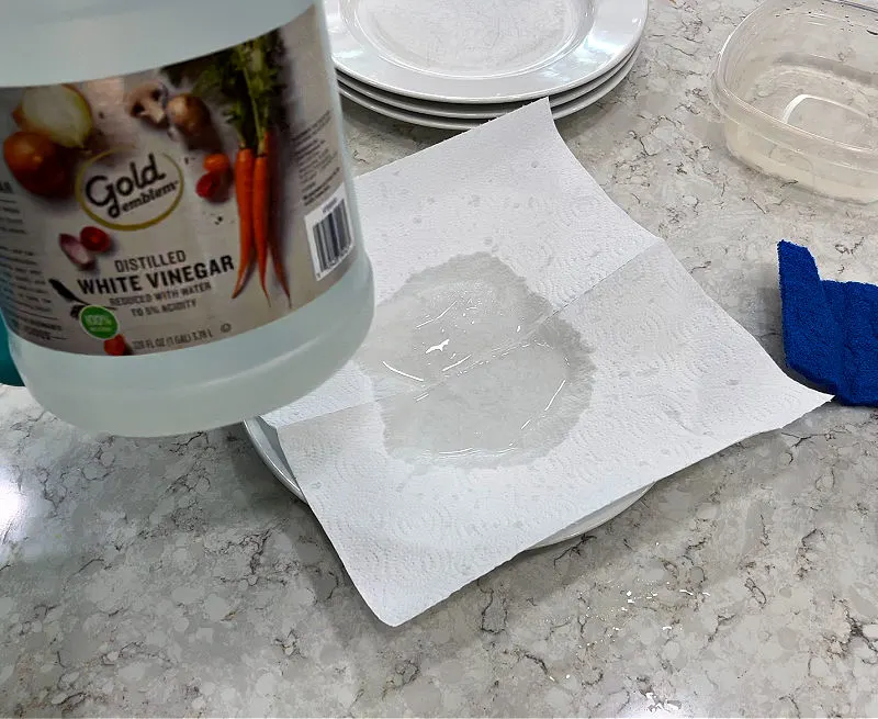 Using vinegar to try to remove scratches on dishes.