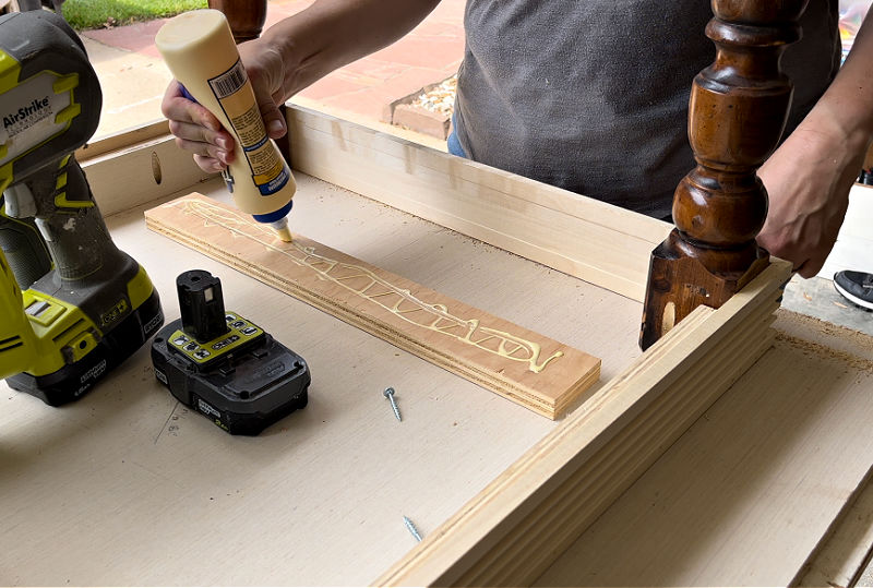 Using glue and pocket holes on a Writing Desk build plan for woodworking.