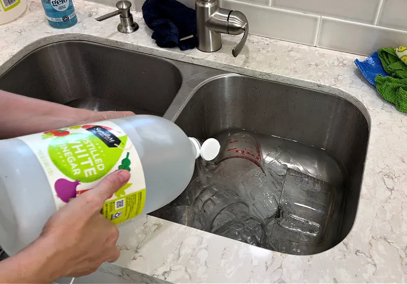 Using Vinegar to clean hard water spots on glassware.