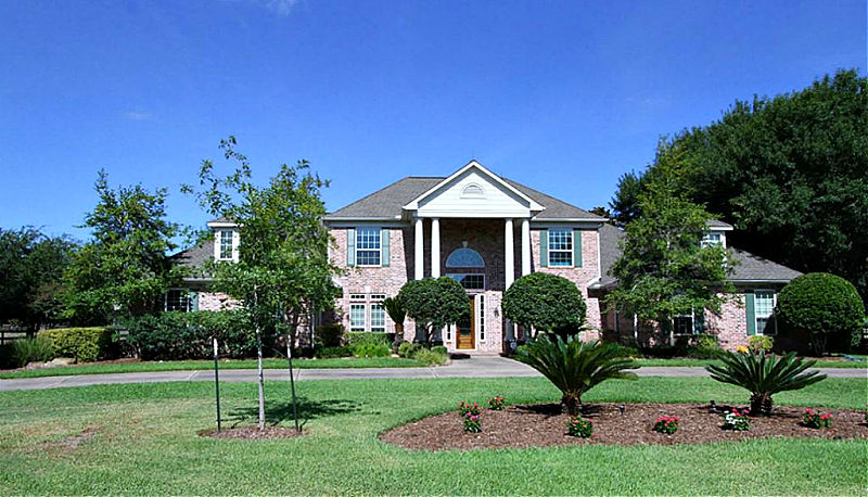 Before photo from a post with tips to make an ugly house look better. Ugliest house in America. Tips for fixing up a fixer upper.