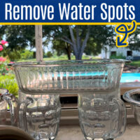 Image of water spots on glasses for a post with 3 easy ways to remove hard water spots on glassware.
