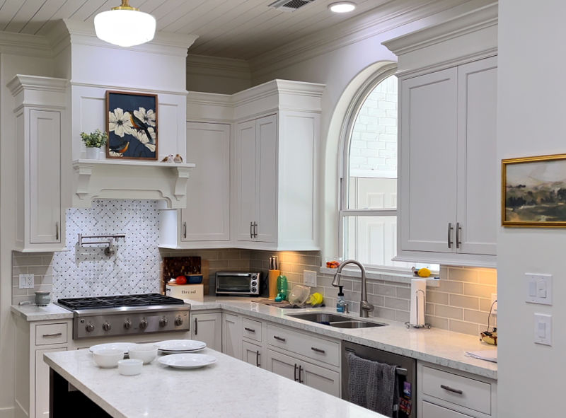 Kitchen with scratched plates on the counter.