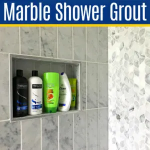 Image of a marble shower with white grout for a post about how to clean marble shower grout and tile.
