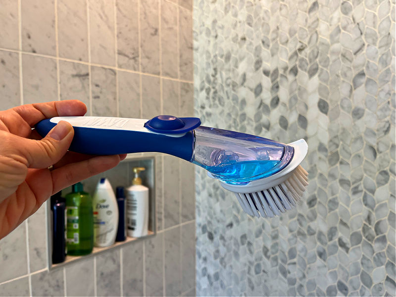 Image of a Dish Wand filled with Dawn Dish Soap to clean marble shower grout and tile.