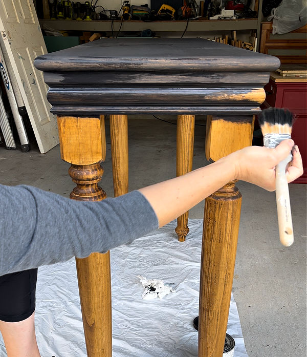 Using a black paint wash on furniture.