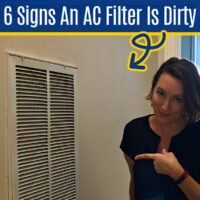 Image of someone cleaning an AC Return Air Vent with a vacuum for a post about signs that your AC Filter Is Dirty and loud air return vents.