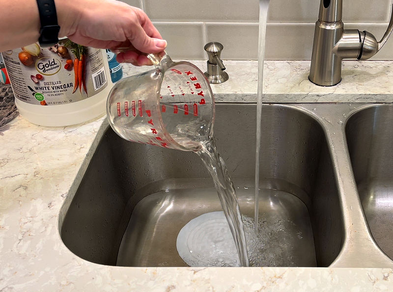 Using vinegar to remove laundry stains.