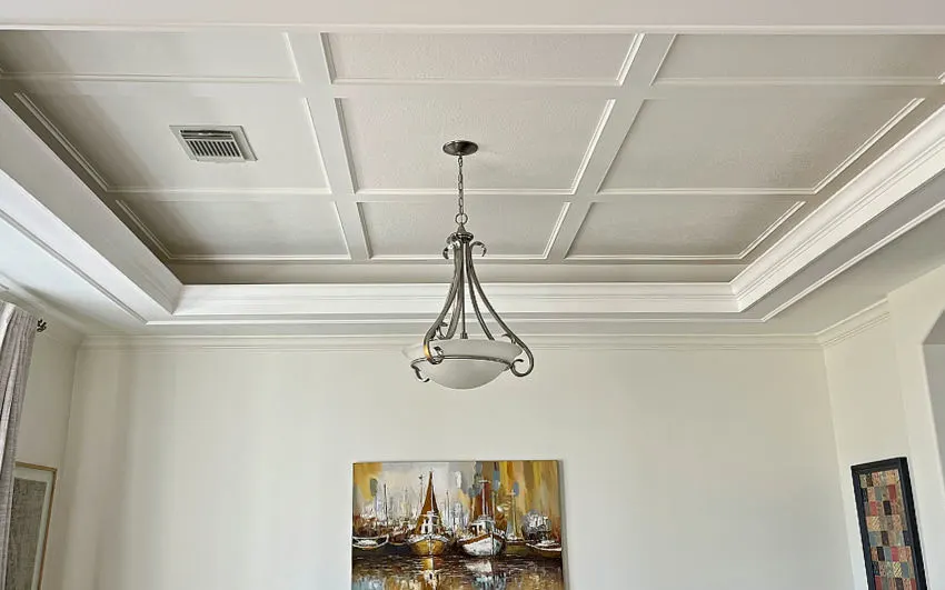 Image of a Dining Room tray ceiling design idea with flat coffered trim and crown molding.